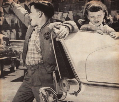 vintage photo 1950s kids looking at cars