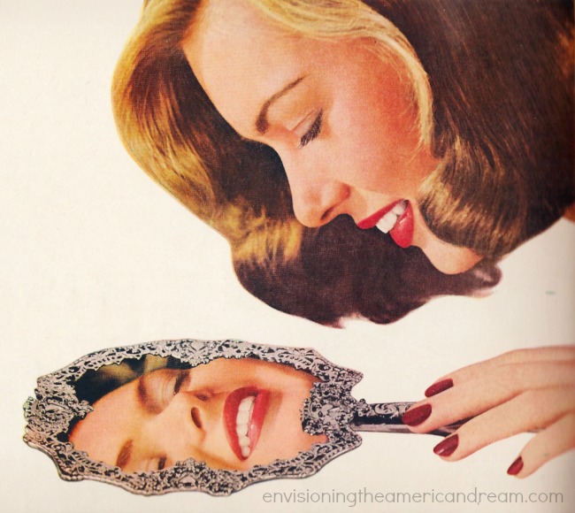 woman looking in mirror