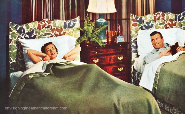 vintage 1950s couple in seperate beds