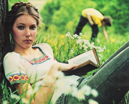 1970s hippy girl reading a book