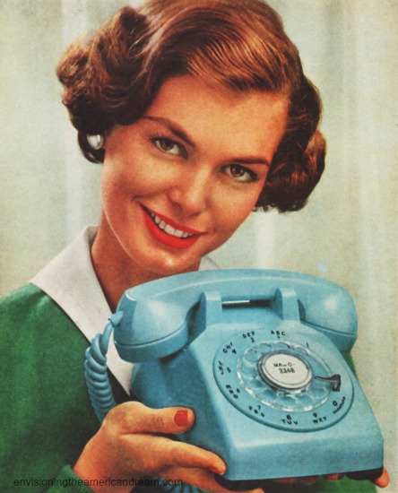 vintage photo housewife holding turquoiuse telephone