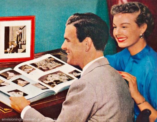 Happy couple looking at scrapbook.