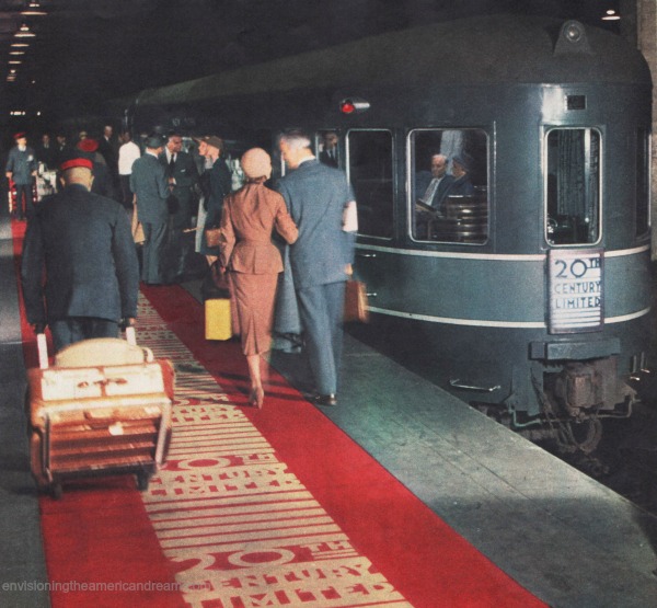 vintage couple walking red carpet to train