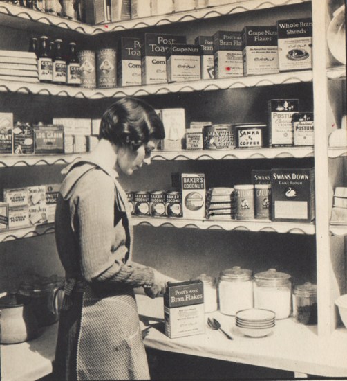 Vintage Houswewife and her well stocked Kitchen cuboard Vintage Housewife in pantry