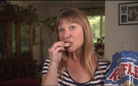 woman eating potato chips
