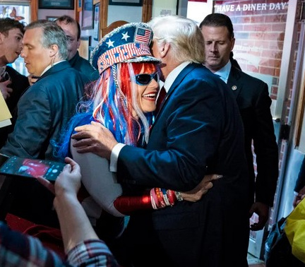 Donald Trump Supporter hugs Trump