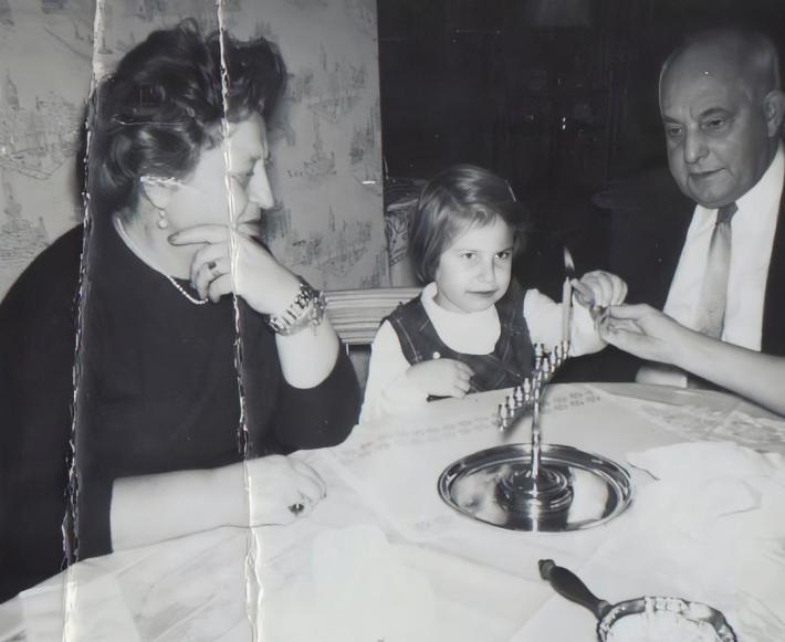 Lighting the menorah first night of Hanukkah 1959 Photo Sally Edelstein collection
